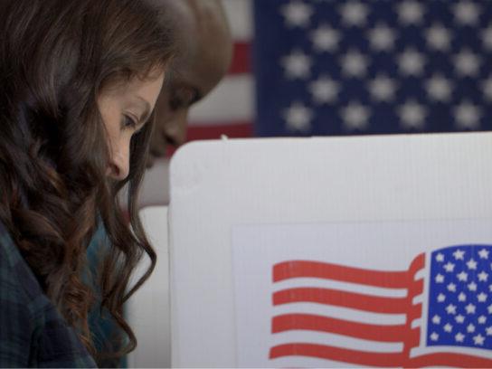 photo of woman and man voting