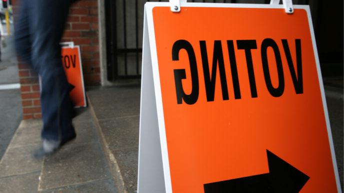 photo of person walking out of polling place on election day